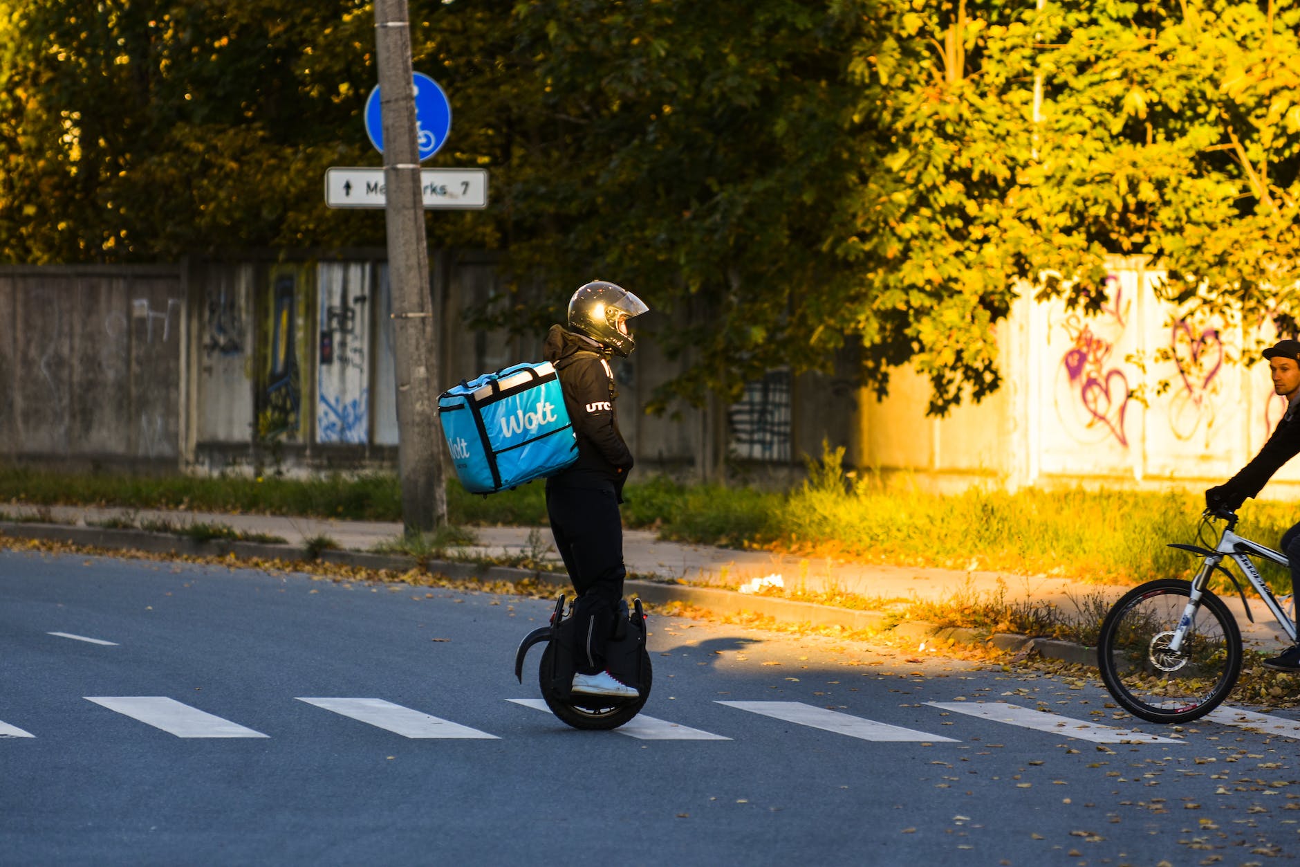 deliver man riding an electric unicycle